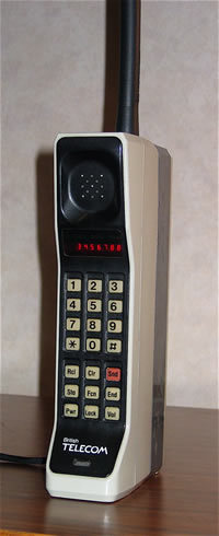 Motorola DynaTAC 8000X brick-style mobile phone with a long antenna, keypad and red LED display